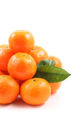 pile of fresh tangerines isolated on white