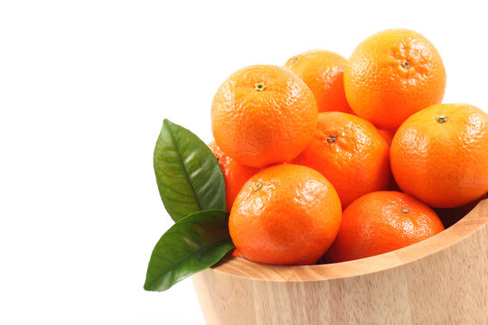 bowl of fresh tangerines isolated on white