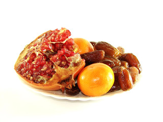 pomegranate. tangerines. dates