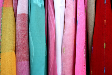 Colorful cloth shawls on a market stall