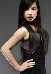 Naklejka premium oriental model posing on grey background