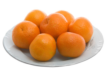 Tangerines on white plate isolated