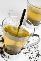 Green tea in glass on white