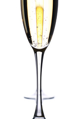 two champagne flutes, one merged behind the other.