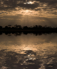 Morning sun rays through clouds in Samburu Reserve, Kenya