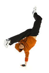 Young hooded bboy standing on one hand. 