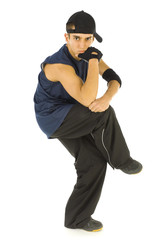 Young man standing on one leg in bboy's pose