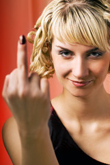 Attractive woman showing middle finger