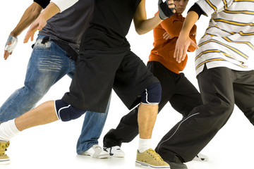 Group of young men standing in bboys pose