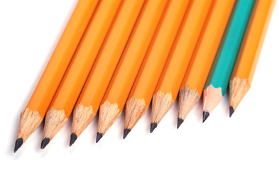 closeup photography of some pencils on white paper