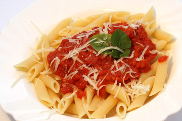 pasta with piquant tomato sauce and grated cheese
