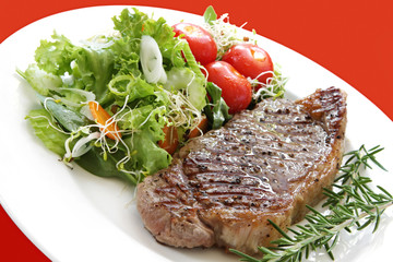 Grilled steak with salad.  