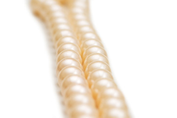Pearl necklace on white - shallow depth of field