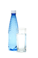 Glass and bottle of water isolated on white