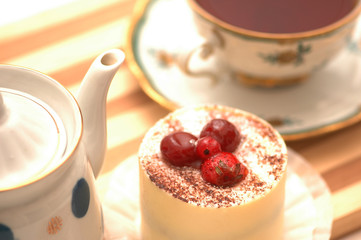 Cake, cake and tea pot on the tray