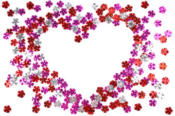 Heart made from the confetti of the flower form