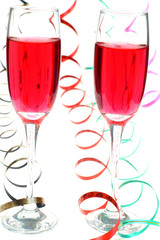 Two red party drink with streamers on white background