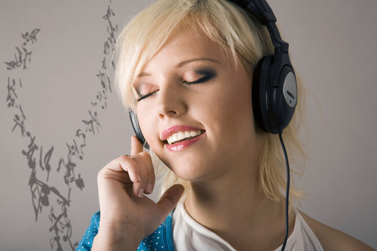 Caucasian woman listening to headphones