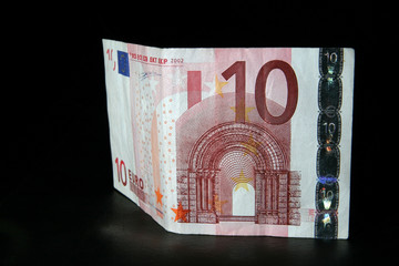 Ten Euro banknote on black leather