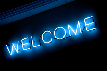 neon "welcome" sign