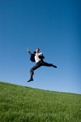 Fototapeta na wymiar Businessman jumping in the air