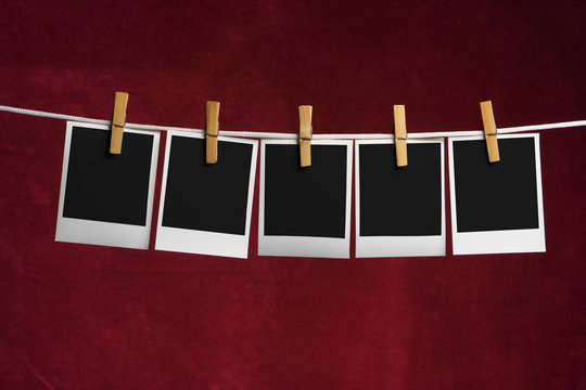 five palaroid blank attach to rope clothes peg