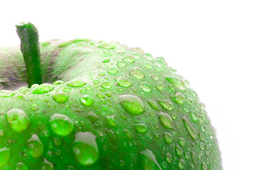Wet green apple isolated on white