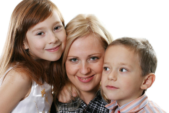 Happy mother with a daughter and the son on a white background