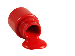 Bright red poster paint spilling onto white background