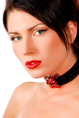 portrait of a brunette girl with red lips and red necklace