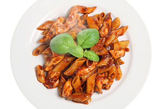 Penne pasta with chicken in a tomato and olive sauce 