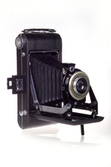Classic folder bellows camera on white background