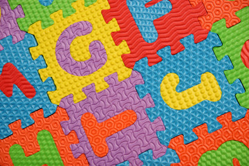 Fototapeta na wymiar multi colored alphabet puzzle background