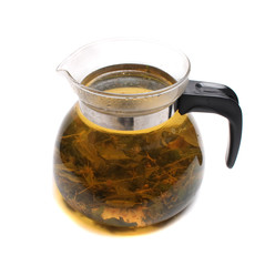 herbal tea in the teapot on the white background