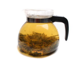 herbal tea in the teapot on the white background