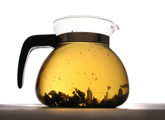 herbal tea in the teapot on the white background