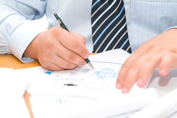 Naklejka premium Business accessories on a background of diagrams.