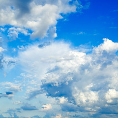 Obraz premium White fluffy clouds in the blue sky.