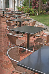 Coffee tables and seats out in the sun