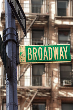 Broadway sign in front of apartment building