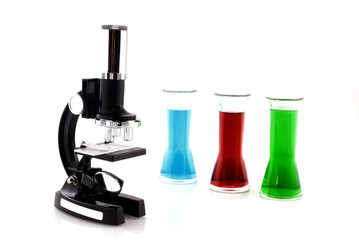 microscope and glasses with liquid in the laboratory