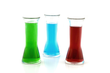 colored liquid in glass bottles