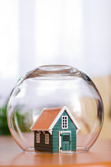 Conceptual view of protecting a house - real estate insurance