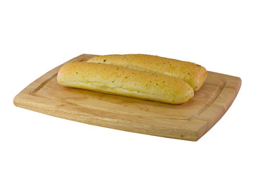 garlic breadsticks on cutting board