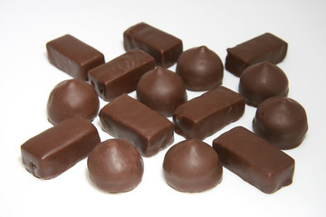 Chocolate sweets of the different form on a white background.