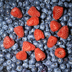 close-up of raspberries and blueberries