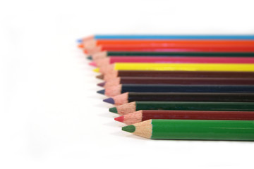 Row of colored pencils with shallow DOF