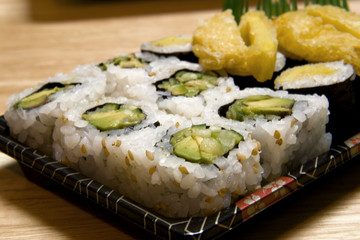 White plate full of japanese food.