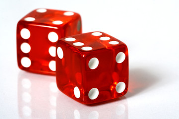 Red and white dice on a white background