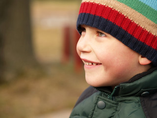 young boy smiling outdoors